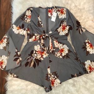 Grey floral romper from Fashion Nova.